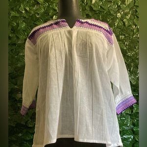 White blouse with purple embroidery